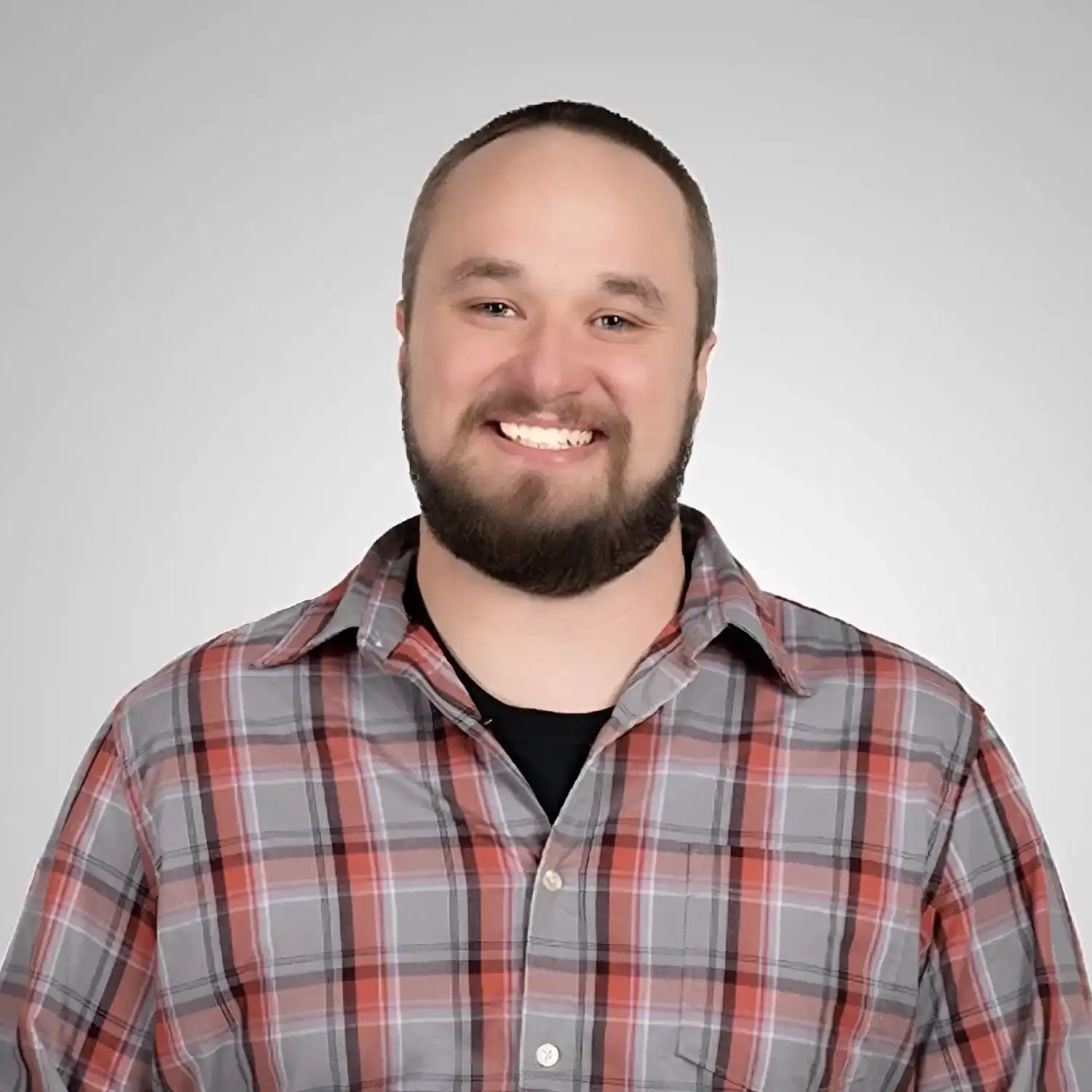 Portrait of Bo, a professional stylist at Prestige Beauty & Wellness by Meevo, showcasing their expertise and style.