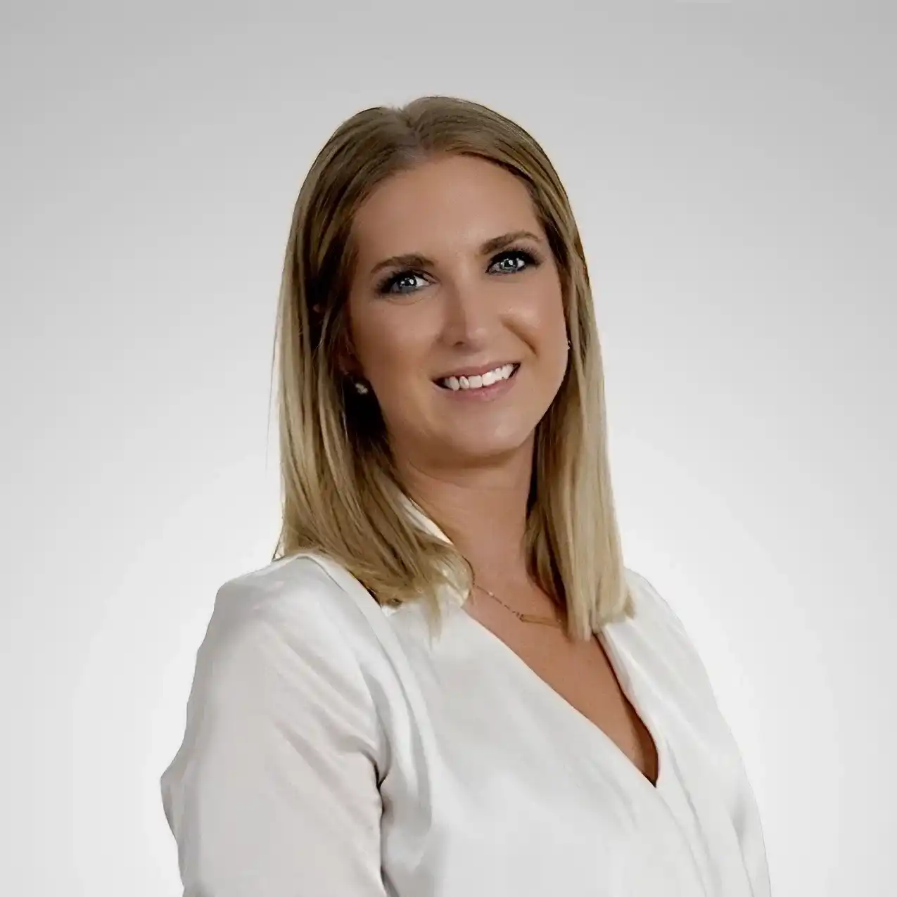 Portrait of Jenna, a professional stylist at Prestige Beauty & Wellness by Meevo, showcasing their expertise and style.