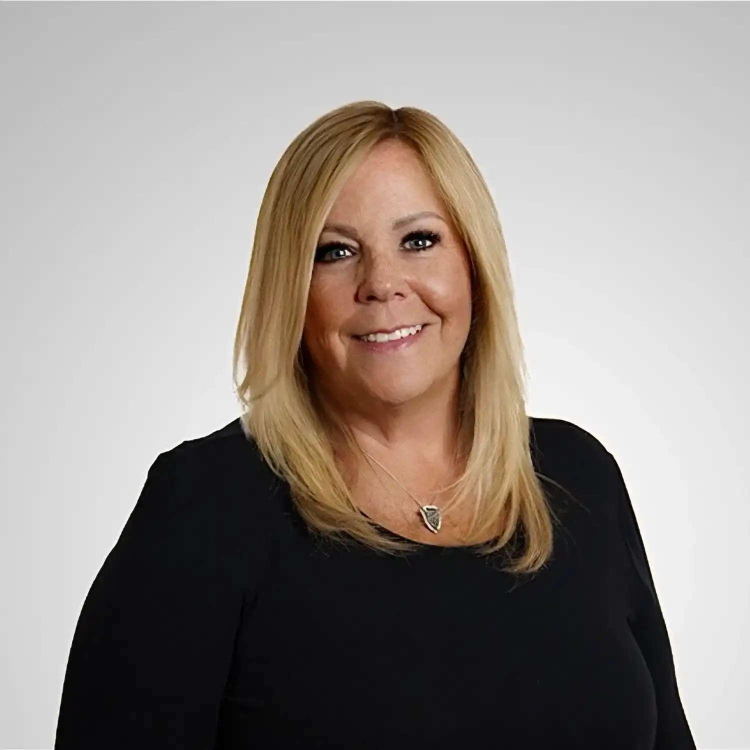 Portrait of Casey, a professional stylist at Prestige Beauty & Wellness by Meevo, showcasing their expertise and style.